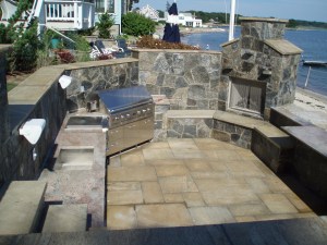 Fabulous outdoor kitchen and stone fireplace built by Preferred Properties Landscaping