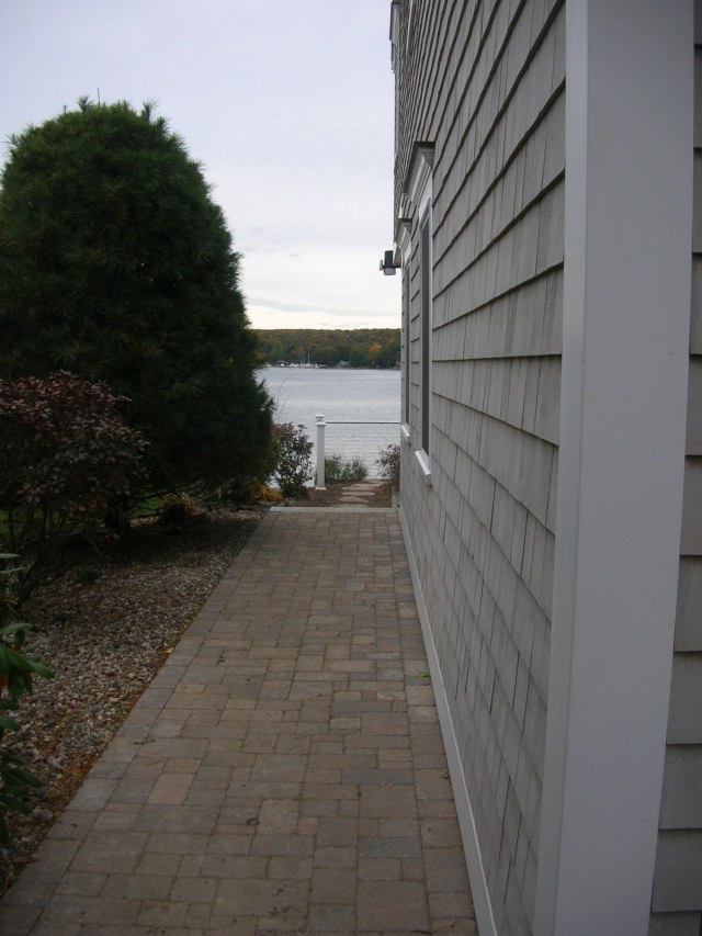 Paver walk along the small side yard built by hand