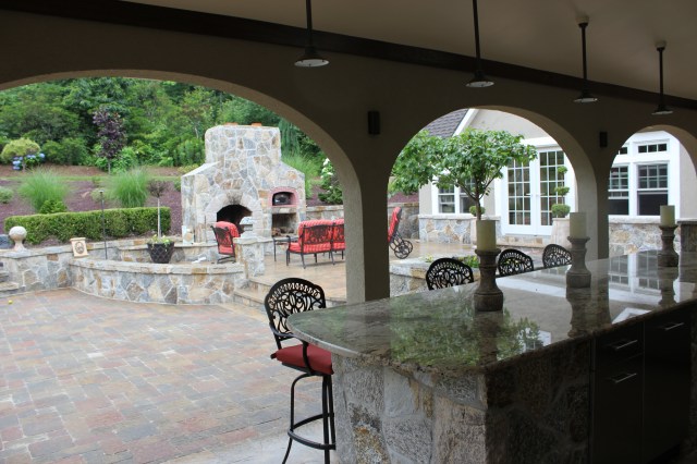 The more dramatic the outdoor fireplace appears, the more dramatic the outdoor living space.