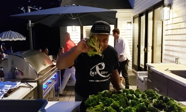 Chef Rudy cooking burnt garlic broccoli on the EVO grill