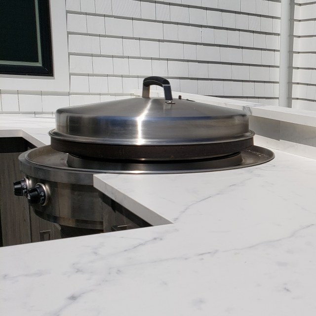 A well equipped outdoor kitchen can cook food from sun up to well past sun down.
